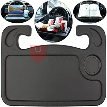 A stainless steel car steering wheel tray with a cup holder on one side and a flat surface on the other. The tray attaches to the steering wheel with a hook and can be folded for storage.